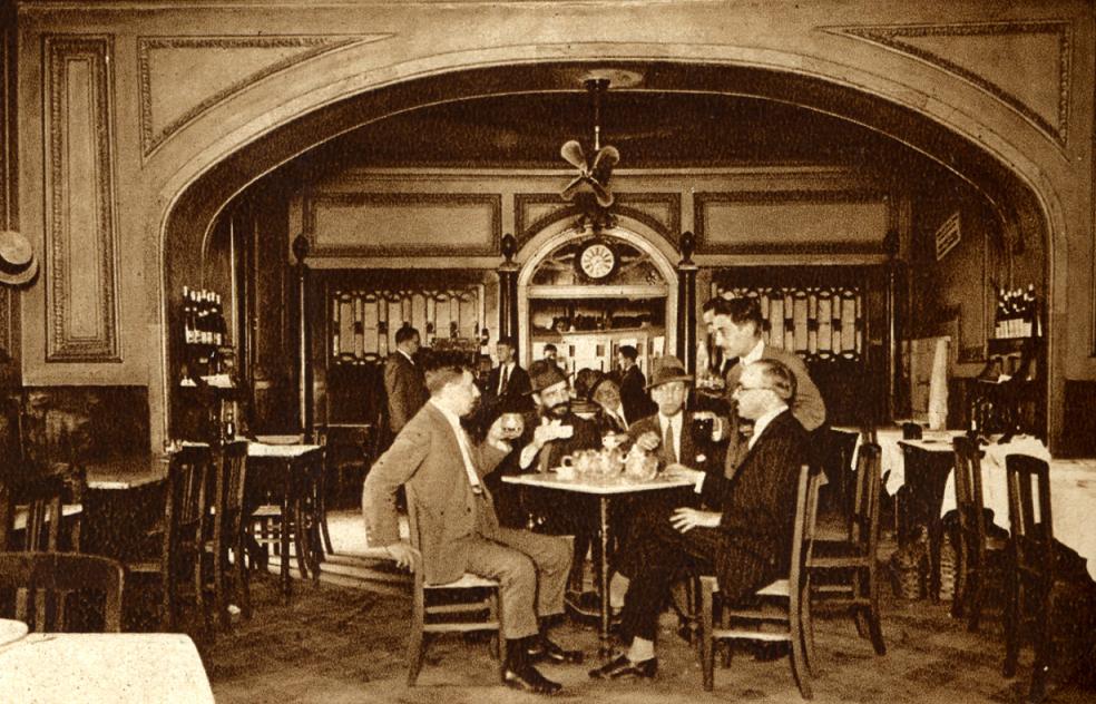 Old photo of Fernando Pessoa having coffee with friends at Martinho da Arcada in Lisbon